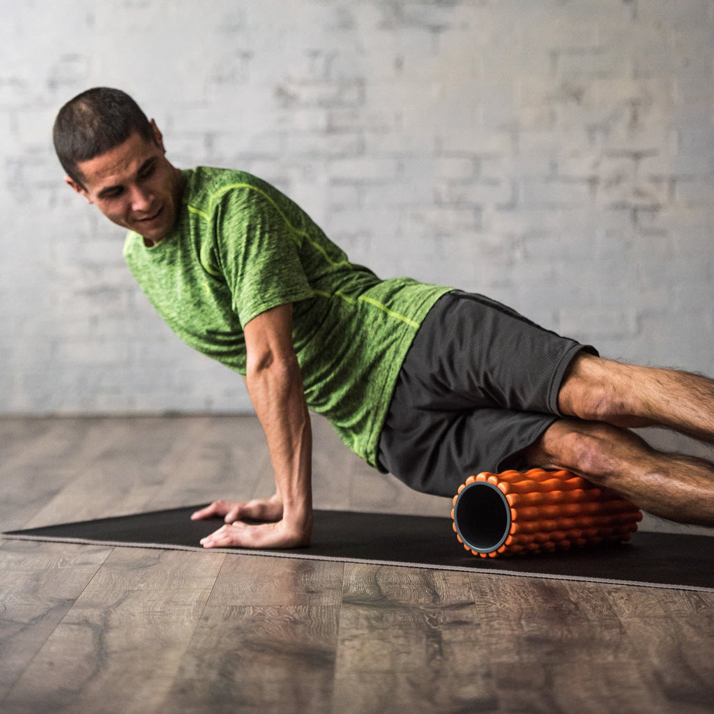 Restore Deep Tissue Foam Roller being used to roll out the thigh