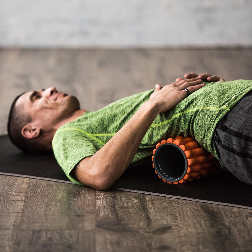 Restore Deep Tissue Foam Roller being used to roll out the back