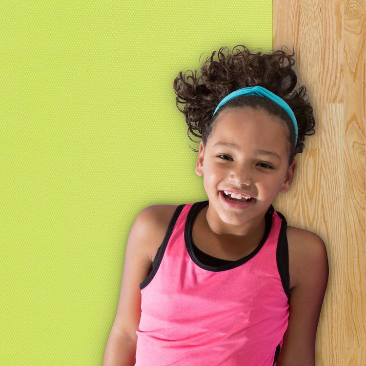 Girl laying on Gaiam Kids Lime Yoga Mat 3 mm